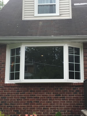 After-Double hung / picture window replaced by beautiful bay window with casements
